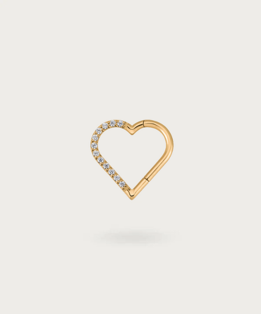 Close-up view of the right golden Daith Titanium Heart Clicker Piercing