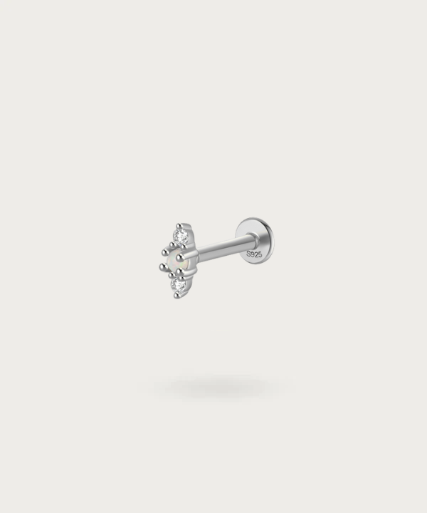 silver ear  Earlobe piercing with precious stones