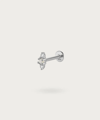 silver ear  Earlobe piercing with precious stones