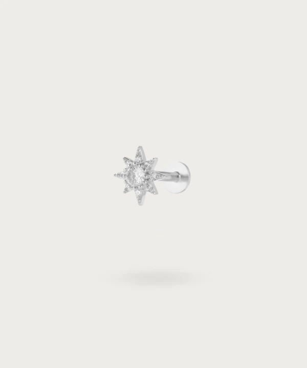 Close-up of the Sun Zircon Helix Piercing, highlighting the brilliant silver details