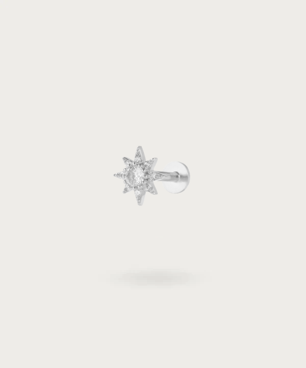 Close-up of the Sun Zircon Flat Piercing, highlighting the brilliant silver details