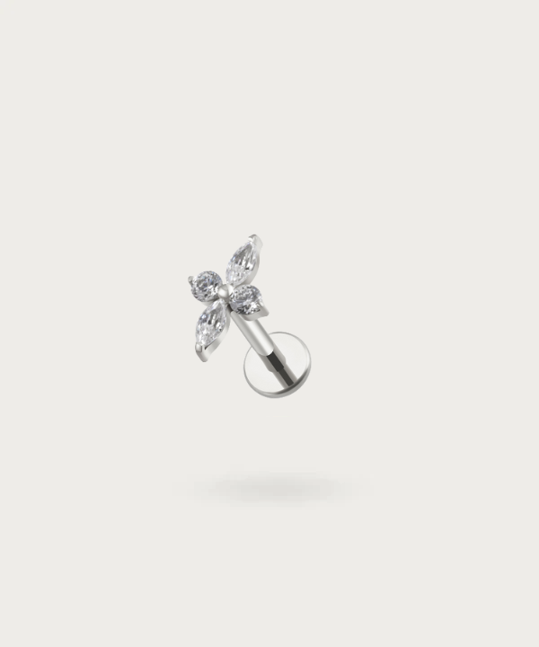 The Helix Flower Piercing on a neutral background, highlighting its delicate floral design. Silver color